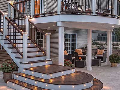 Two-story Trex deck with lights on the steps of the staircase